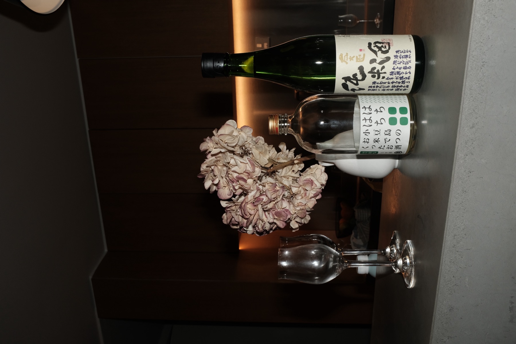 Bottles and hydrangea on the counter