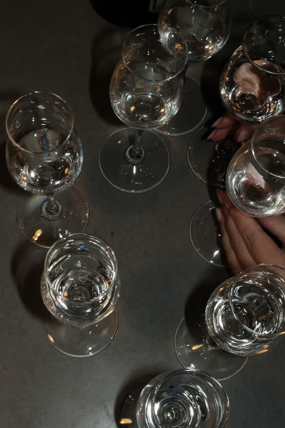 Glasses on a dark table, seen from above